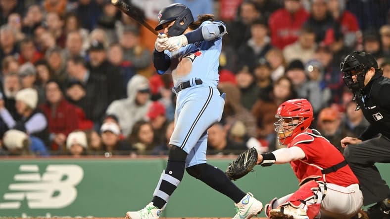 May 4, 2023; Boston, Massachusetts, USA; Toronto Blue Jays shortstop Bo Bichette (11) hits a two RBI single against the Boston Red Sox during the fifth inning at Fenway Park. Mandatory Credit: Brian Fluharty-USA TODAY Sports