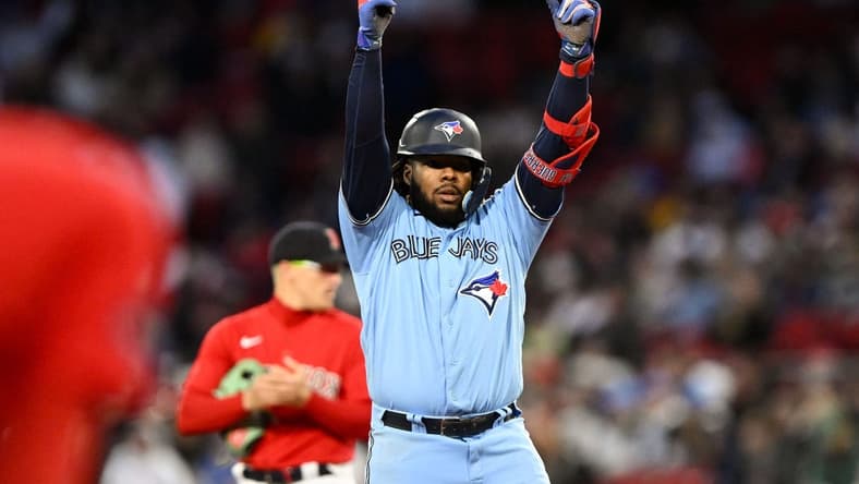 May 4, 2023; Boston, Massachusetts, USA; Toronto Blue Jays first baseman Vladimir Guerrero Jr. (27) reacts after hitting a RBI double against the Boston Red Sox during the fifth inning at Fenway Park. Mandatory Credit: Brian Fluharty-USA TODAY Sports