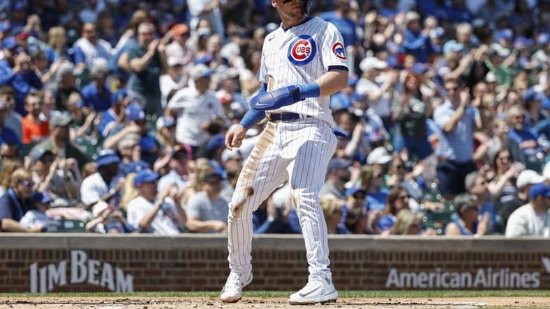 May 5, 2023; Chicago, Illinois, USA; Chicago Cubs second baseman Nico Hoerner (2) scores against the Miami Marlins during the first inning at Wrigley Field. Mandatory Credit: Kamil Krzaczynski-USA TODAY Sports