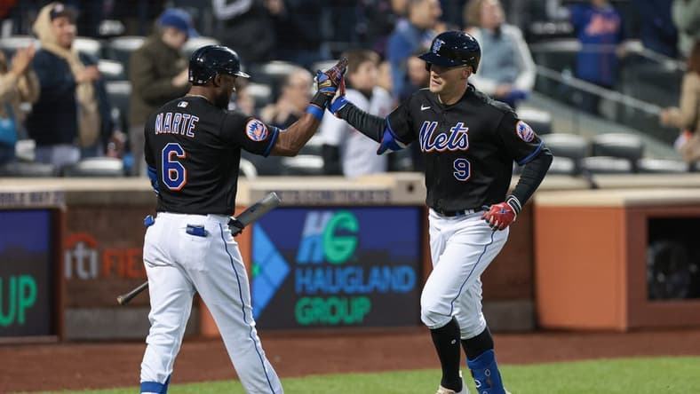 May 5, 2023; New York City, New York, USA; New York Mets center fielder Brandon Nimmo (9) celebrates his solo home run with right fielder Starling Marte (6) during the fourth inning against Colorado Rockies at Citi Field. Mandatory Credit: Vincent Carchietta-USA TODAY Sports