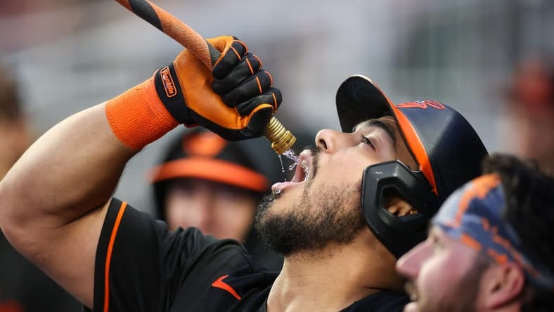 May 5, 2023; Atlanta, Georgia, USA; Baltimore Orioles right fielder Anthony Santander (25) drinks from the homer hose after a home run against the Atlanta Braves in the fourth inning at Truist Park. Mandatory Credit: Brett Davis-USA TODAY Sports