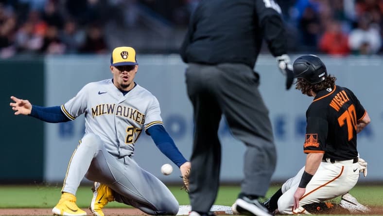 May 5, 2023; San Francisco, California, USA;  San Francisco Giants second baseman Brett Wisely (70) steals second base in front of Milwaukee Brewers shortstop Willy Adames (27) during the second inning at Oracle Park. Mandatory Credit: John Hefti-USA TODAY Sports