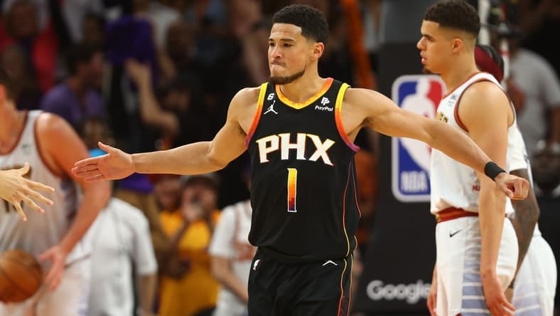 May 5, 2023; Phoenix, Arizona, USA; Phoenix Suns guard Devin Booker (1) celebrates with teammates against the Denver Nuggets in the second half during game three of the 2023 NBA playoffs at Footprint Center. Mandatory Credit: Mark J. Rebilas-USA TODAY Sports