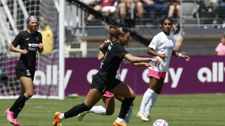 May 6, 2023; Washington, DC, USA; Washington Spirit forward Trinity Rodman (2) is defended by San Diego Wave FC midfielder Danielle Colaprico (24) in a NWSL game at Audi Field. Mandatory Credit: Geoff Burke-USA TODAY Sports