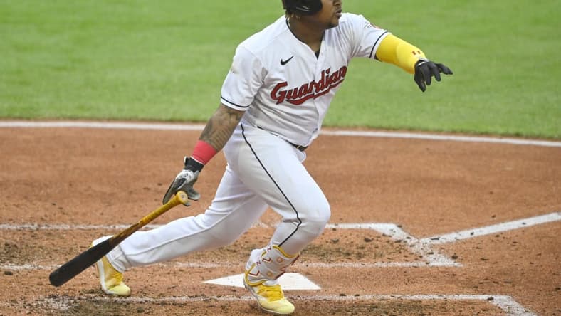 May 6, 2023; Cleveland, Ohio, USA; Cleveland Guardians third baseman Jose Ramirez (11) hits a single against the Minnesota Twins in the fourth inning at Progressive Field. Mandatory Credit: David Richard-USA TODAY Sports