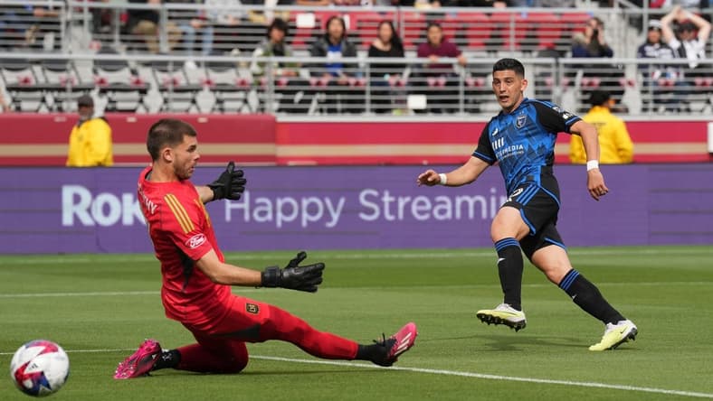May 6, 2023; Santa Clara, California, USA; San Jose Earthquakes forward Cristian Espinoza (10) scores a goal against Los Angeles FC goalkeeper John McCarthy (77)  during the first half at Levi's Stadium. Mandatory Credit: Darren Yamashita-USA TODAY Sports