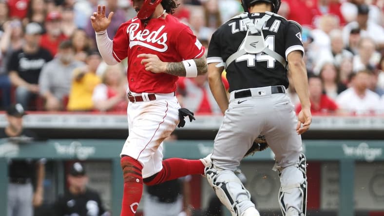 May 6, 2023; Cincinnati, Ohio, USA; Cincinnati Reds second baseman Jonathan India (6) scores against Chicago White Sox catcher Seby Zavala (44) during the first inning at Great American Ball Park. Mandatory Credit: David Kohl-USA TODAY Sports