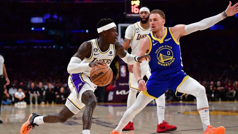 May 6, 2023; Los Angeles, California, USA; Los Angeles Lakers guard Dennis Schroder (17) moves the ball against Golden State Warriors guard Donte DiVincenzo (0) during the first half in game three of the 2023 NBA playoffs at Crypto.com Arena. Mandatory Credit: Gary A. Vasquez-USA TODAY Sports