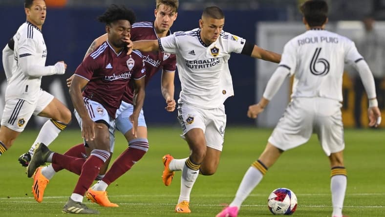 May 6, 2023; Carson, California, USA; Colorado Rapids midfielder Ralph Priso (97) and Los Angeles Galaxy forward Dejan Joveljic (9) battle for the ball during the first half at Dignity Health Sports Park. Mandatory Credit: Jayne Kamin-Oncea-USA TODAY Sports
