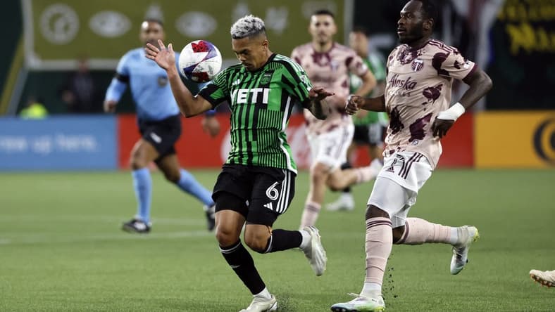May 6, 2023; Portland, Oregon, USA; Austin FC midfielder Daniel Pereira (6) controls the ball against Portland Timbers forward Franck Boli (7, right) during the first half at Providence Park. Mandatory Credit: Soobum Im-USA TODAY Sports