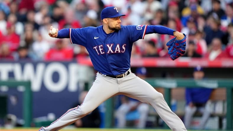 May 6, 2023; Anaheim, California, USA; Texas Rangers relief pitcher Dane Dunning (33) throws against the Los Angeles Angels in the third inning at Angel Stadium. Mandatory Credit: Kirby Lee-USA TODAY Sports