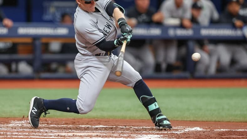 May 7, 2023; St. Petersburg, Florida, USA; New York Yankees center fielder Harrison Bader (22) hits a tw0 run home run against the Tampa Bay Rays in the third inning at Tropicana Field. Mandatory Credit: Nathan Ray Seebeck-USA TODAY Sports