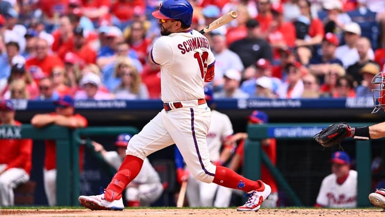 May 7, 2023; Philadelphia, Pennsylvania, USA; Philadelphia Phillies outfielder Kyle Schwarber (12) hits an RBI single against the Boston Red Sox in the fourth inning at Citizens Bank Park. Mandatory Credit: Kyle Ross-USA TODAY Sports