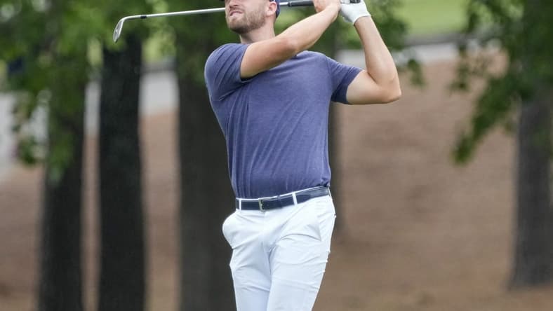 May 7, 2023; Charlotte, North Carolina, USA; Wyndham Clark hits his approach shot on five during the final round of the Wells Fargo Championship golf tournament. Mandatory Credit: Jim Dedmon-USA TODAY Sports