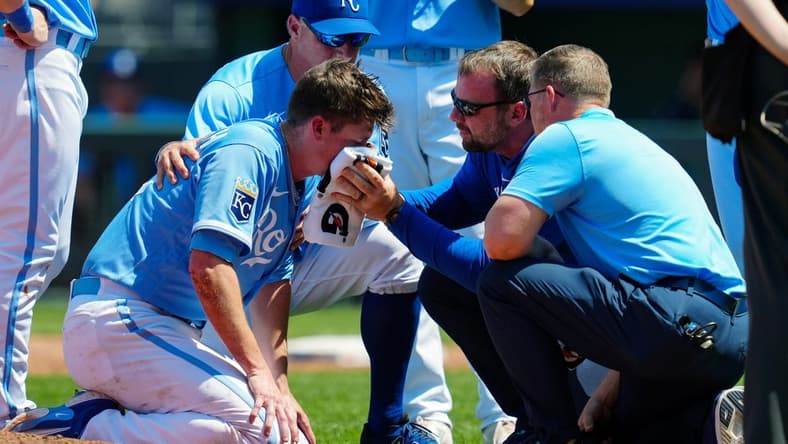 May 7, 2023; Kansas City, Missouri, USA; Kansas City Royals relief pitcher Ryan Yarbrough (48) is attended to by medical staff after being hit by a line drive off the bat of Oakland Athletics first baseman Ryan Noda (not pictured) during the sixth inning at Kauffman Stadium. Mandatory Credit: Jay Biggerstaff-USA TODAY Sports