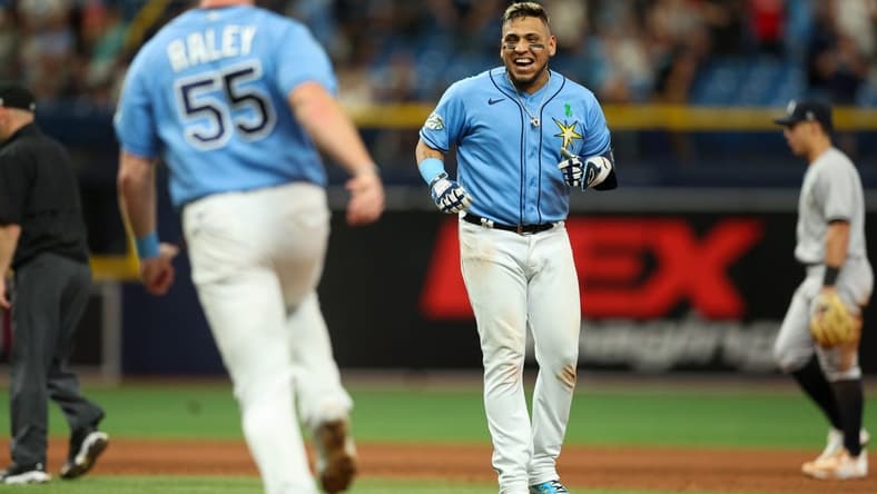 May 7, 2023; St. Petersburg, Florida, USA; Tampa Bay Rays third baseman Isaac Paredes (17) hits a walk off single against the New York Yankees in the tenth inning at Tropicana Field. Mandatory Credit: Nathan Ray Seebeck-USA TODAY Sports