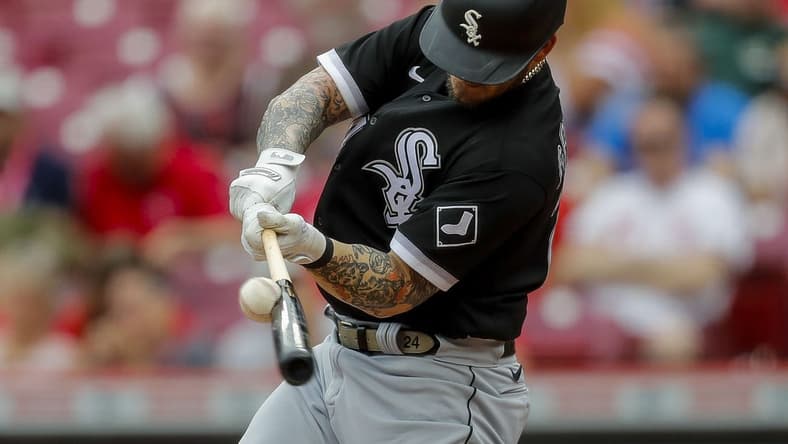 May 7, 2023; Cincinnati, Ohio, USA; Chicago White Sox designated hitter Yasmani Grandal (24) hits a single in the second inning against the Cincinnati Reds at Great American Ball Park. Mandatory Credit: Katie Stratman-USA TODAY Sports