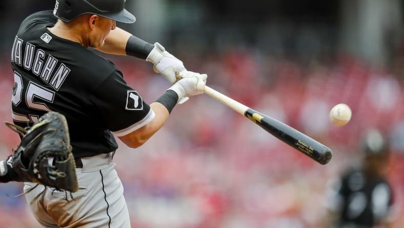 May 7, 2023; Cincinnati, Ohio, USA; Chicago White Sox first baseman Andrew Vaughn (25) hits a sacrifice fly against the Cincinnati Reds in the fifth inning at Great American Ball Park. Mandatory Credit: Katie Stratman-USA TODAY Sports