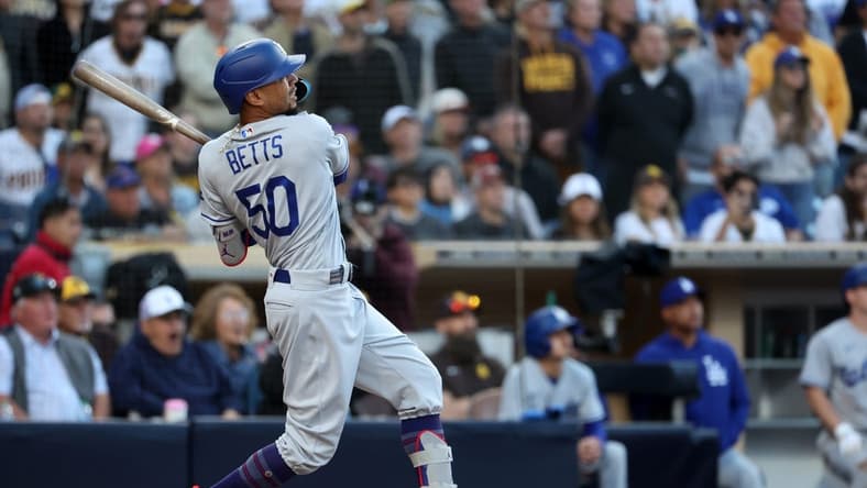 May 7, 2023; San Diego, California, USA; Los Angeles Dodgers right fielder Mookie Betts (50) hits a home run during the ninth inning against the San Diego Padres at Petco Park. Mandatory Credit: Kiyoshi Mio-USA TODAY Sports