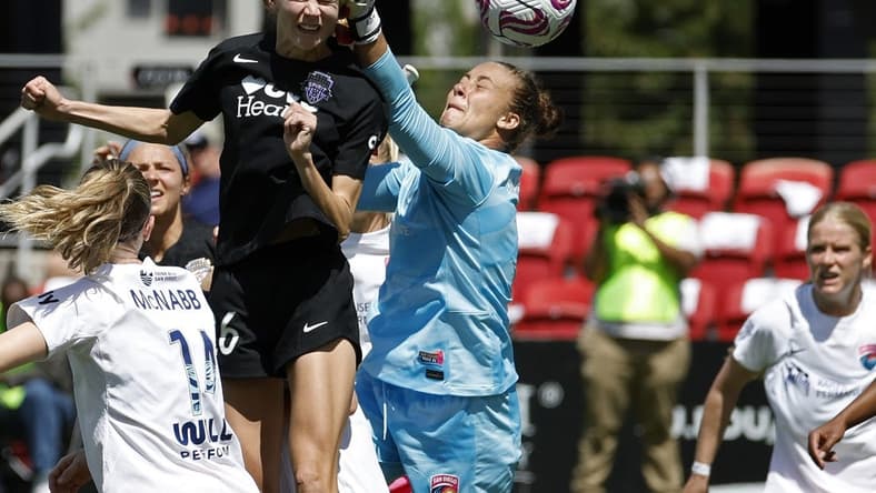 May 6, 2023; Washington, District of Columbia, USA; Washington Spirit midfielder Paige Metayer (26)  scores a goal on San Diego Wave FC goalkeeper Kailen Sheridan (1) at Audi Field. Mandatory Credit: Geoff Burke-USA TODAY Sports