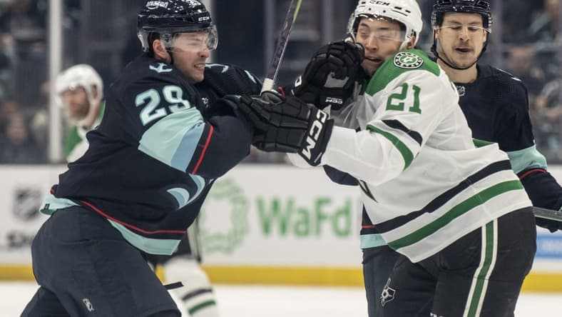 May 7, 2023; Seattle, Washington, USA; Seattle Kraken defenseman Vince Dunn (29) and Dallas Stars forward Jason Robertson (21) shove one another during the first period in game three of the second round of the 2023 Stanley Cup Playoffs at Climate Pledge Arena. Mandatory Credit: Stephen Brashear-USA TODAY Sports