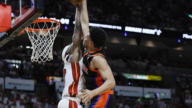 May 8, 2023; Miami, Florida, USA; Miami Heat forward Jimmy Butler (22) blocks a dunk attempt from New York Knicks guard Quentin Grimes (6) in the second quarter during game four of the 2023 NBA playoffs at Kaseya Center. Mandatory Credit: Sam Navarro-USA TODAY Sports
