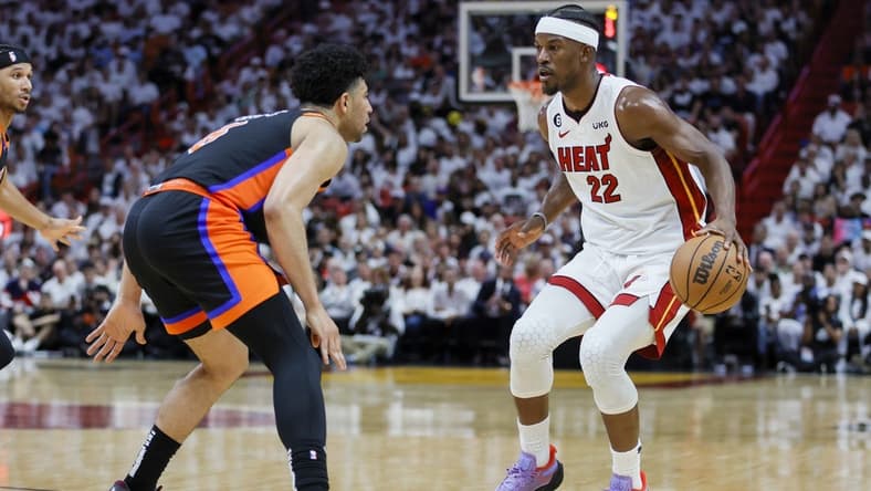 May 8, 2023; Miami, Florida, USA; Miami Heat forward Jimmy Butler (22) dribbles the basketball as New York Knicks guard Quentin Grimes (6) defends in the third quarter during game four of the 2023 NBA playoffs at Kaseya Center. Mandatory Credit: Sam Navarro-USA TODAY Sports