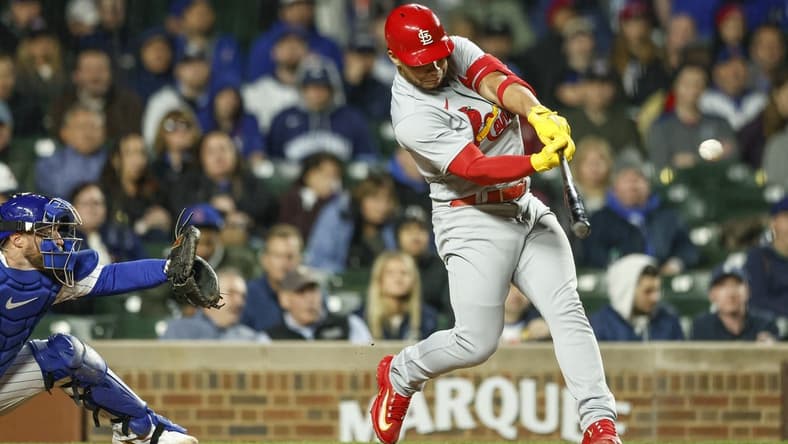 May 8, 2023; Chicago, Illinois, USA; St. Louis Cardinals catcher Willson Contreras (40) hits an RBI-double against the Chicago Cubs during sixth inning at Wrigley Field. Mandatory Credit: Kamil Krzaczynski-USA TODAY Sports