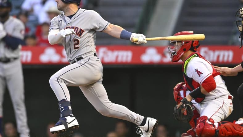 May 8, 2023; Anaheim, California, USA; Houston Astros third baseman Alex Bregman (2) hits a RBI triple in the third inning against the Los Angeles Angels at Angel Stadium. Mandatory Credit: Jayne Kamin-Oncea-USA TODAY Sports