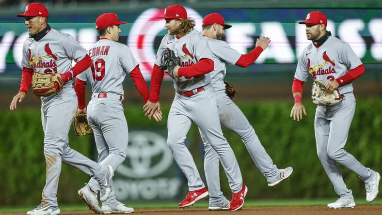 May 8, 2023; Chicago, Illinois, USA; St. Louis Cardinals players celebrate after defeating the Chicago Cubs at Wrigley Field. Mandatory Credit: Kamil Krzaczynski-USA TODAY Sports