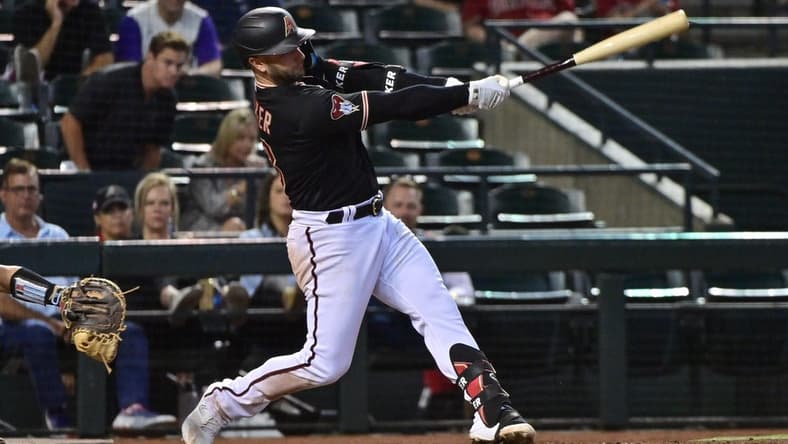May 8, 2023; Phoenix, Arizona, USA; Arizona Diamondbacks first baseman Christian Walker (53) hits a solo home run in the sixth inning against the Miami Marlins at Chase Field. Mandatory Credit: Matt Kartozian-USA TODAY Sports