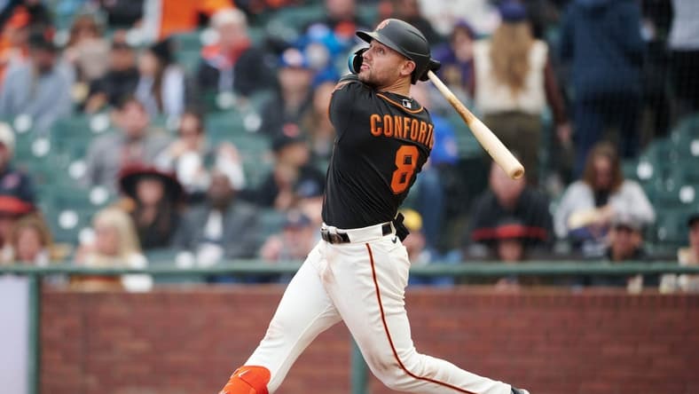 May 6, 2023; San Francisco, California, USA; San Francisco Giants outfielder Michael Conforto (8) bats against the Milwaukee Brewers during the seventh inning at Oracle Park. Mandatory Credit: Robert Edwards-USA TODAY Sports