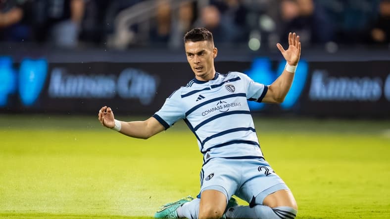 Apr 25, 2023; Kansas City, KS, USA; Sporting Kansas City midfielder Erik Thommy (26) slides after a foul during the second half against Tulsa Athletic at Children's Mercy Park. Mandatory Credit: Jay Biggerstaff-USA TODAY Sports