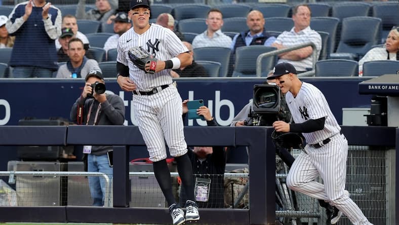 May 9, 2023; Bronx, New York, USA; New York Yankees right fielder Aaron Judge (99) and first baseman Anthony Rizzo (48) take the field for the first inning against the Oakland Athletics at Yankee Stadium. Mandatory Credit: Brad Penner-USA TODAY Sports