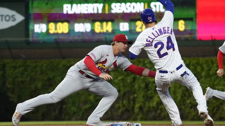 May 9, 2023; Chicago, Illinois, USA; St. Louis Cardinals second baseman Nolan Gorman (16) tags out Chicago Cubs center fielder Cody Bellinger (24) at second base on a steal attempt during the third inning at Wrigley Field. Mandatory Credit: David Banks-USA TODAY Sports