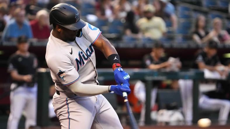 May 9, 2023; Phoenix, Arizona, USA; Miami Marlins designated hitter Jorge Soler (12) hits a three run home run against the Arizona Diamondbacks during the first inning at Chase Field. Mandatory Credit: Joe Camporeale-USA TODAY Sports