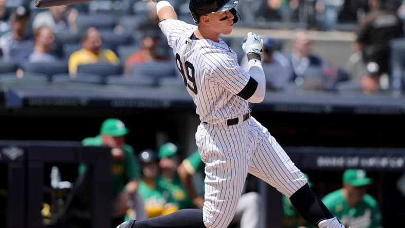 May 10, 2023; Bronx, New York, USA; New York Yankees designated hitter Aaron Judge (99) follows through on a double against the Oakland Athletics during the fifth inning at Yankee Stadium. Mandatory Credit: Brad Penner-USA TODAY Sports