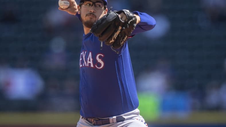 May 10, 2023; Seattle, Washington, USA; Texas Rangers starter Dane Dunning (33) delivers a pitch during the first inning against the Seattle Mariners at T-Mobile Park. Mandatory Credit: Stephen Brashear-USA TODAY Sports