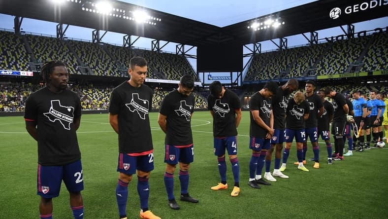 May 10, 2023; Nashville, TN, USA; FC Dallas players observe a moment of silence for the shooting victims of Allen, TX over the weekend before the match against the Nashville SC at GEODIS Park. Mandatory Credit: Christopher Hanewinckel-USA TODAY Sports