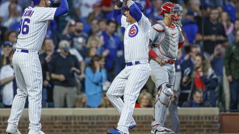 May 10, 2023; Chicago, Illinois, USA; Chicago Cubs catcher Yan Gomes (15) celebrates with first baseman Trey Mancini (36) after hitting a two-run home run against the St. Louis Cardinals during the fourth inning at Wrigley Field. Mandatory Credit: Kamil Krzaczynski-USA TODAY Sports