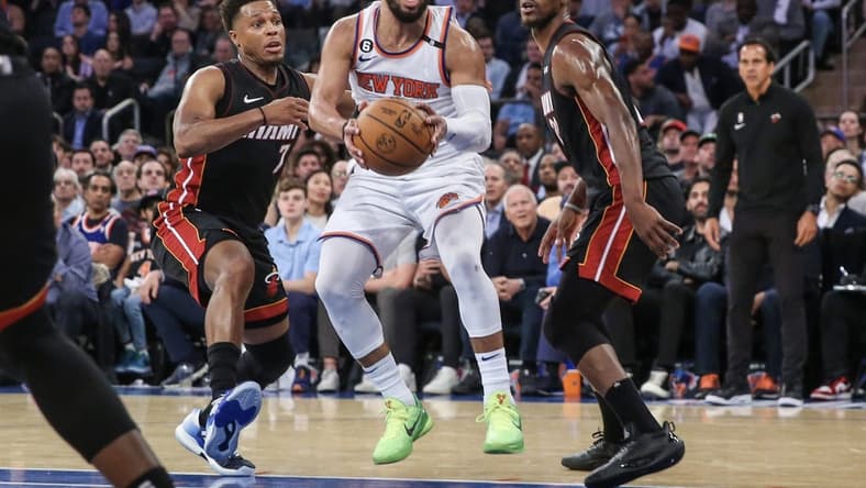 May 10, 2023; New York, New York, USA; New York Knicks guard Jalen Brunson (11) drives past Miami Heat guard Kyle Lowry (7) and forward Jimmy Butler (22) during game five of the 2023 NBA playoffs at Madison Square Garden. Mandatory Credit: Wendell Cruz-USA TODAY Sports