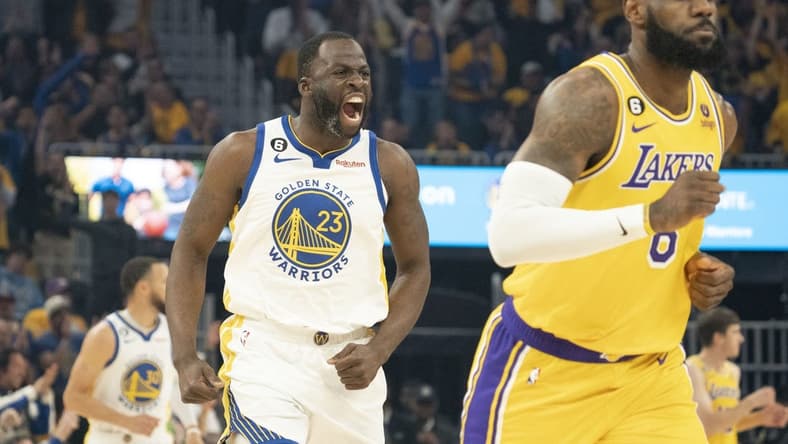 May 10, 2023; San Francisco, California, USA; Golden State Warriors forward Draymond Green (23) celebrates against Los Angeles Lakers forward LeBron James (6) during the first quarter in game five of the 2023 NBA playoffs conference semifinals round at Chase Center. Mandatory Credit: Kyle Terada-USA TODAY Sports