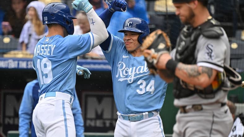 May 11, 2023; Kansas City, Missouri, USA;  Kansas City Royals second baseman Michael Massey (19) celebrates with catcher Freddy Fermin (34) after hitting a solo home run during the second inning against the Chicago White Sox at Kauffman Stadium. Mandatory Credit: Peter Aiken-USA TODAY Sports