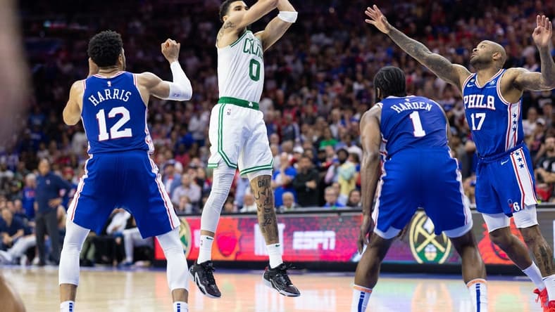 May 11, 2023; Philadelphia, Pennsylvania, USA; Boston Celtics forward Jayson Tatum (0) shoots the ball against Philadelphia 76ers forward Tobias Harris (12) and forward P.J. Tucker (17) during the fourth quarter in game six of the 2023 NBA playoffs at Wells Fargo Center. Mandatory Credit: Bill Streicher-USA TODAY Sports