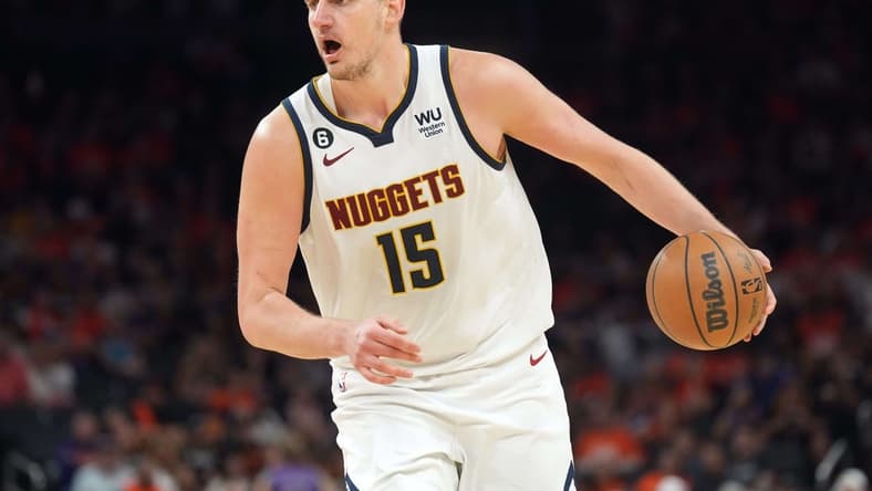 May 11, 2023; Phoenix, Arizona, USA; Denver Nuggets center Nikola Jokic (15) dribbles against the Phoenix Suns during the second half of game six of the 2023 NBA playoffs at Footprint Center. Mandatory Credit: Joe Camporeale-USA TODAY Sports