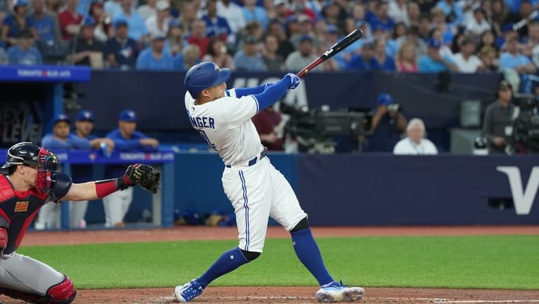 May 12, 2023; Toronto, Ontario, CAN; Toronto Blue Jays right fielder George Springer (4) hits a double scoring a run against the Atlanta Braves during the fifth inning at Rogers Centre. Mandatory Credit: Nick Turchiaro-USA TODAY Sports