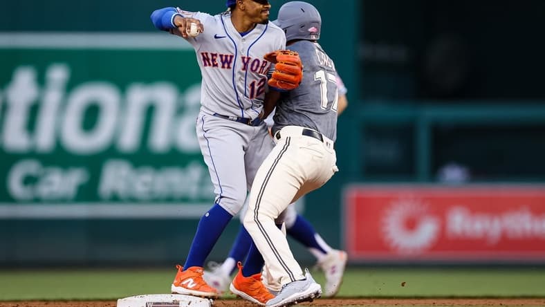 May 12, 2023; Washington, District of Columbia, USA; New York Mets shortstop Francisco Lindor (12) retires Washington Nationals center fielder Alex Call (17) while turning a double play during the second inning at Nationals Park. Mandatory Credit: Scott Taetsch-USA TODAY Sports