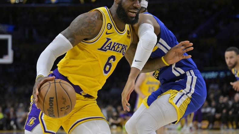May 12, 2023; Los Angeles, California, USA; Los Angeles Lakers forward LeBron James (6) is defended by Golden State Warriors guard Moses Moody (4) as he drives to the basket in the first half of game six of the 2023 NBA playoffs at Crypto.com Arena. Mandatory Credit: Jayne Kamin-Oncea-USA TODAY Sports