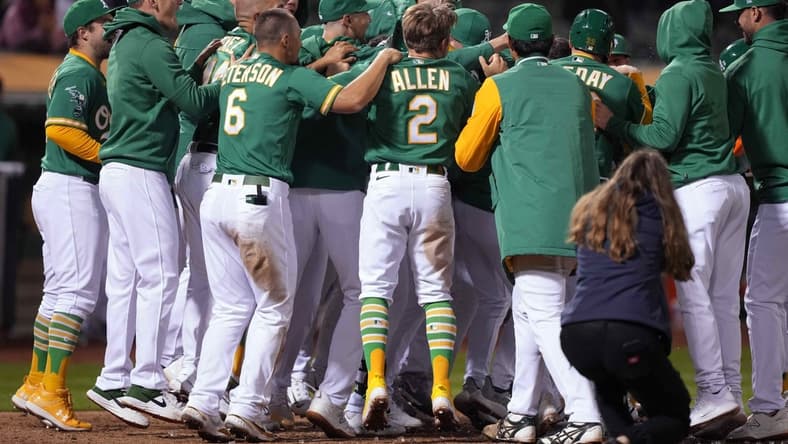 May 12, 2023; Oakland, California, USA; Oakland Athletics players celebrate at home plate after defeating the Texas Rangers at Oakland-Alameda County Coliseum. Mandatory Credit: Darren Yamashita-USA TODAY Sports