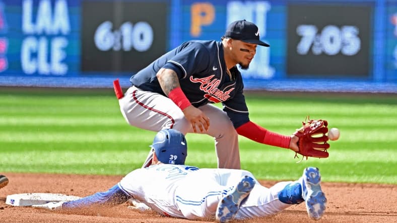 May 13, 2023; Toronto, Ontario, CAN; Toronto Blue Jays center fielder Kevin Kiermaier (39) slides safely into second base with a double as Atlanta Braves shortstop Orlando Arcia (11) takes the throw in the fifth inning at Rogers Centre. Mandatory Credit: Dan Hamilton-USA TODAY Sports